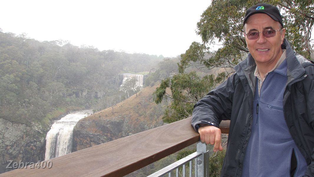 16-Laurie watches the spectacular twin falls at Ebor.JPG